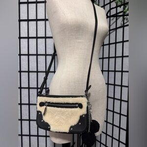 Coach Rhyder Pochette  crossbody bag in Shearling w Studs